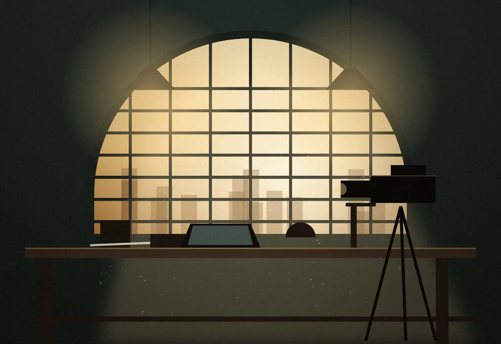 A creative studio and working office: desk, shelving and a cinema camera under arched windows